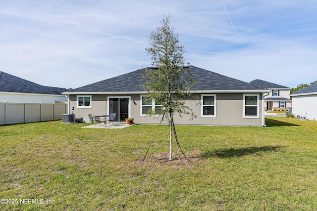 back of house featuring a patio area, a yard, and fence