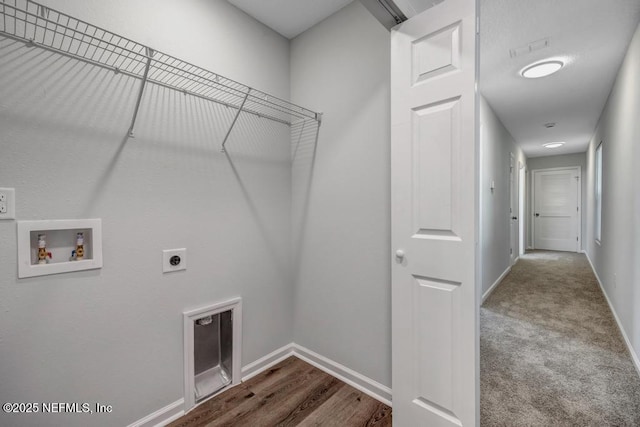 laundry room with laundry area, hookup for a washing machine, baseboards, and hookup for an electric dryer