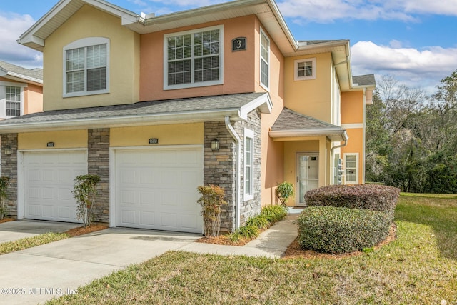 multi unit property with concrete driveway, stone siding, roof with shingles, an attached garage, and stucco siding