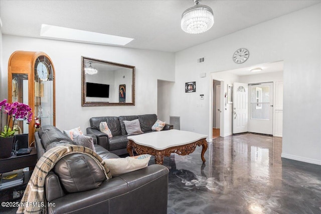 living room with baseboards, visible vents, a chandelier, and concrete flooring