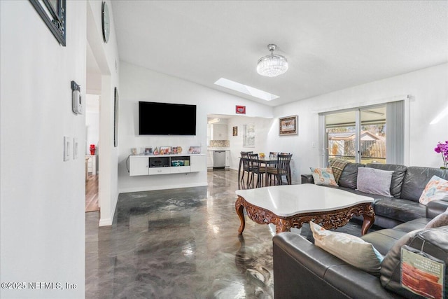 living area featuring finished concrete flooring and lofted ceiling with skylight