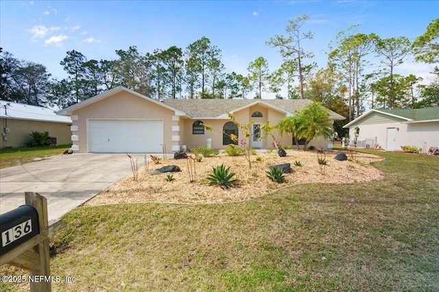 ranch-style home with a front yard, concrete driveway, an attached garage, and stucco siding