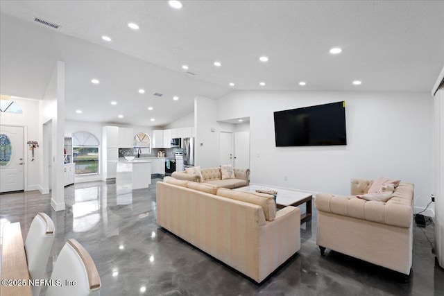 living area with high vaulted ceiling, recessed lighting, visible vents, and baseboards