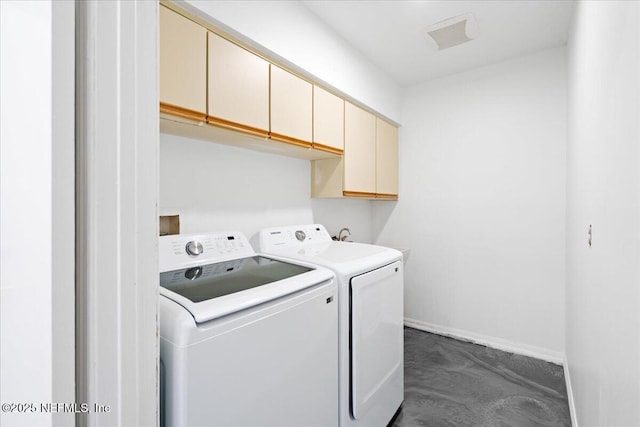 laundry room with independent washer and dryer, cabinet space, and baseboards