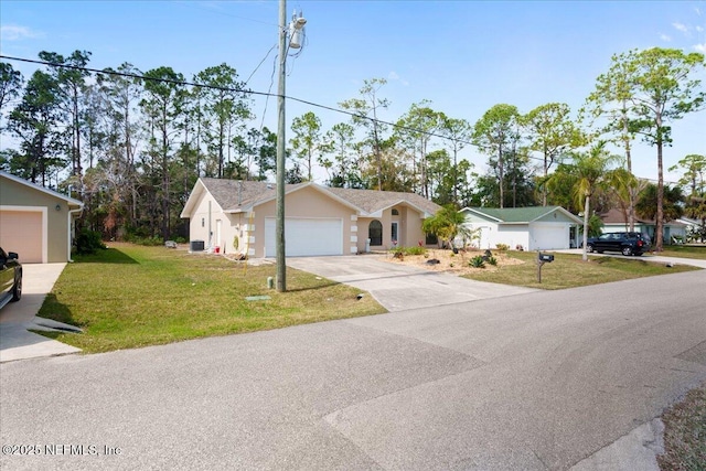 ranch-style house with an attached garage, concrete driveway, and a front yard