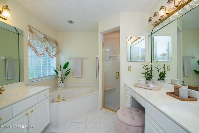 full bathroom with a textured ceiling, a sink, marble finish floor, a bath, and a stall shower