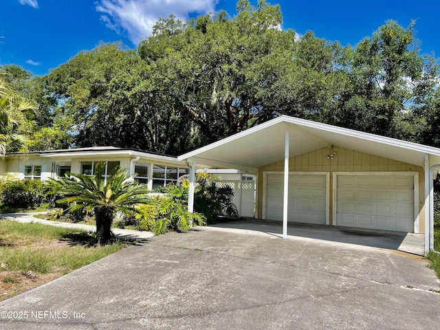 mid-century home featuring a garage