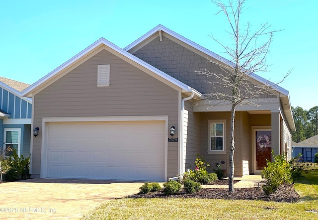 view of front of house with driveway and an attached garage