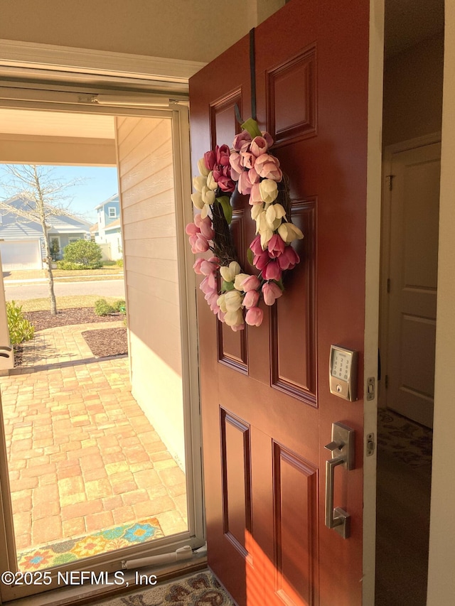 view of exterior entry with a porch