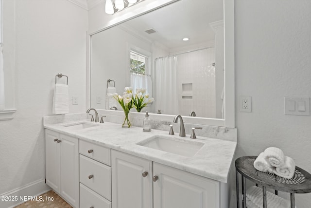 full bathroom with crown molding, curtained shower, visible vents, and a sink