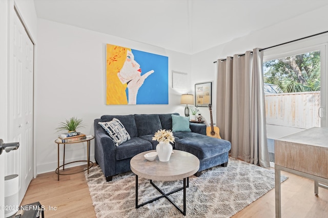 living room with wood finished floors and baseboards