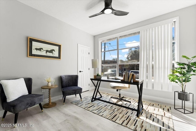 office area featuring ceiling fan, baseboards, and wood finished floors