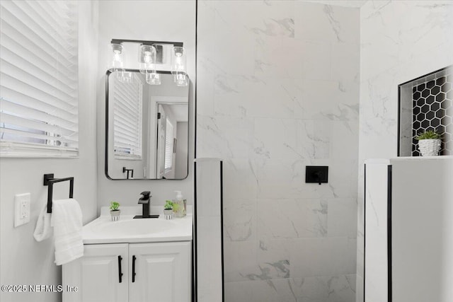 bathroom with vanity and a walk in shower