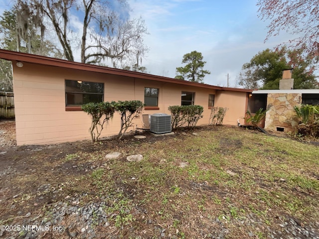 back of property with central air condition unit