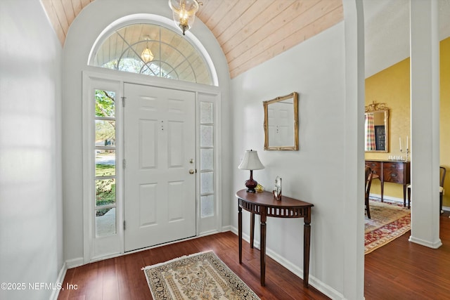 foyer entrance featuring hardwood / wood-style flooring, wood ceiling, baseboards, and vaulted ceiling