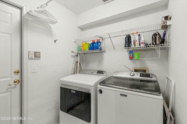 laundry room featuring laundry area and washing machine and clothes dryer