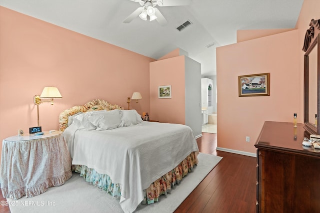 bedroom with baseboards, visible vents, ceiling fan, wood finished floors, and vaulted ceiling