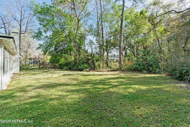 view of yard featuring fence