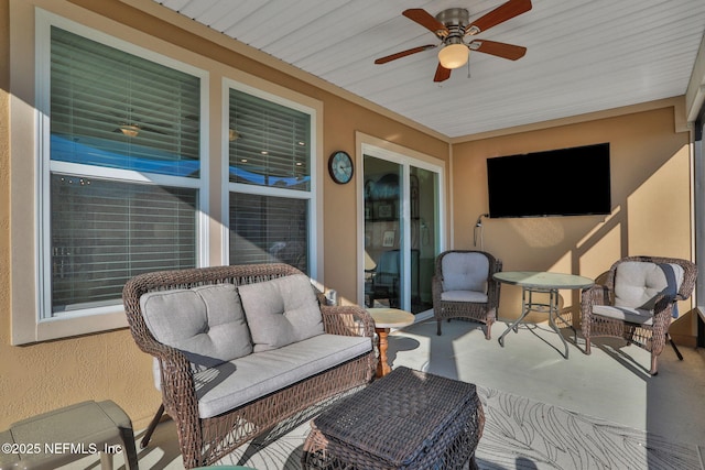 view of patio with ceiling fan and an outdoor hangout area