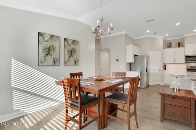 dining space featuring vaulted ceiling, crown molding, light wood-type flooring, a notable chandelier, and recessed lighting