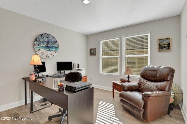 home office featuring wood tiled floor and baseboards