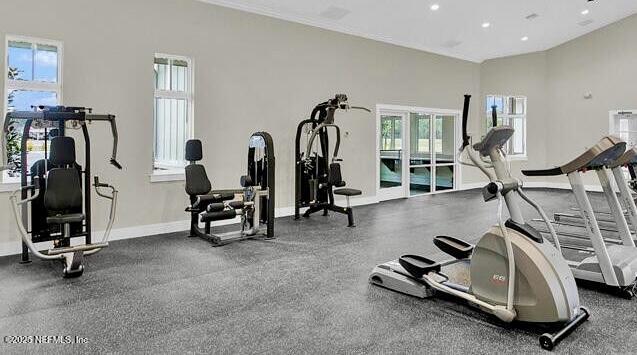 workout area featuring recessed lighting and baseboards