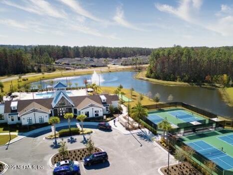 bird's eye view featuring a water view and a wooded view