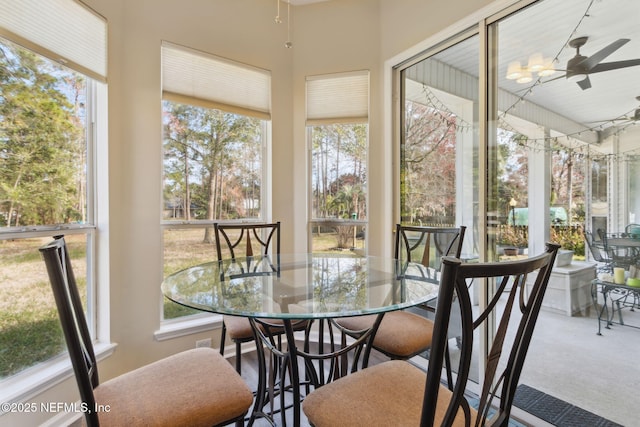 sunroom / solarium featuring ceiling fan