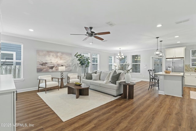 living area featuring ornamental molding, dark wood-style flooring, visible vents, and baseboards