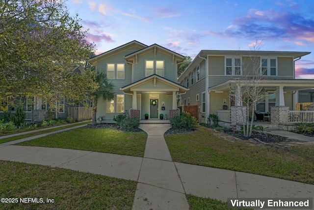 view of front of home featuring a porch and a front yard