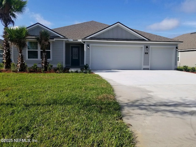 ranch-style house featuring a garage, a shingled roof, concrete driveway, a front lawn, and board and batten siding