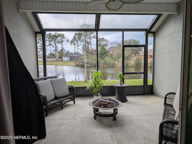 sunroom / solarium with a water view