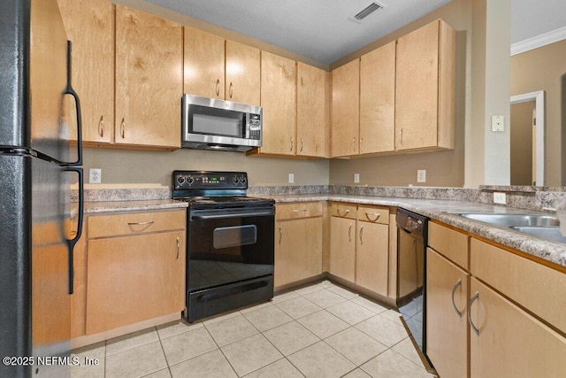 kitchen with light tile patterned floors, light brown cabinets, visible vents, light countertops, and black appliances