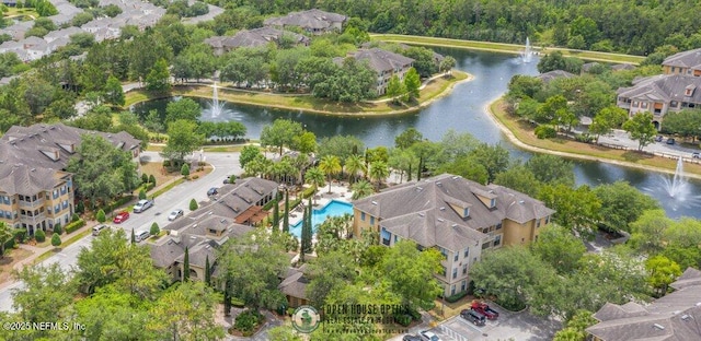 birds eye view of property featuring a water view and a residential view