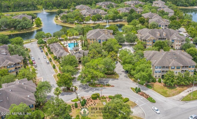 bird's eye view featuring a residential view and a water view