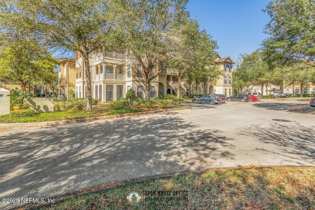 exterior space with curbs and a residential view