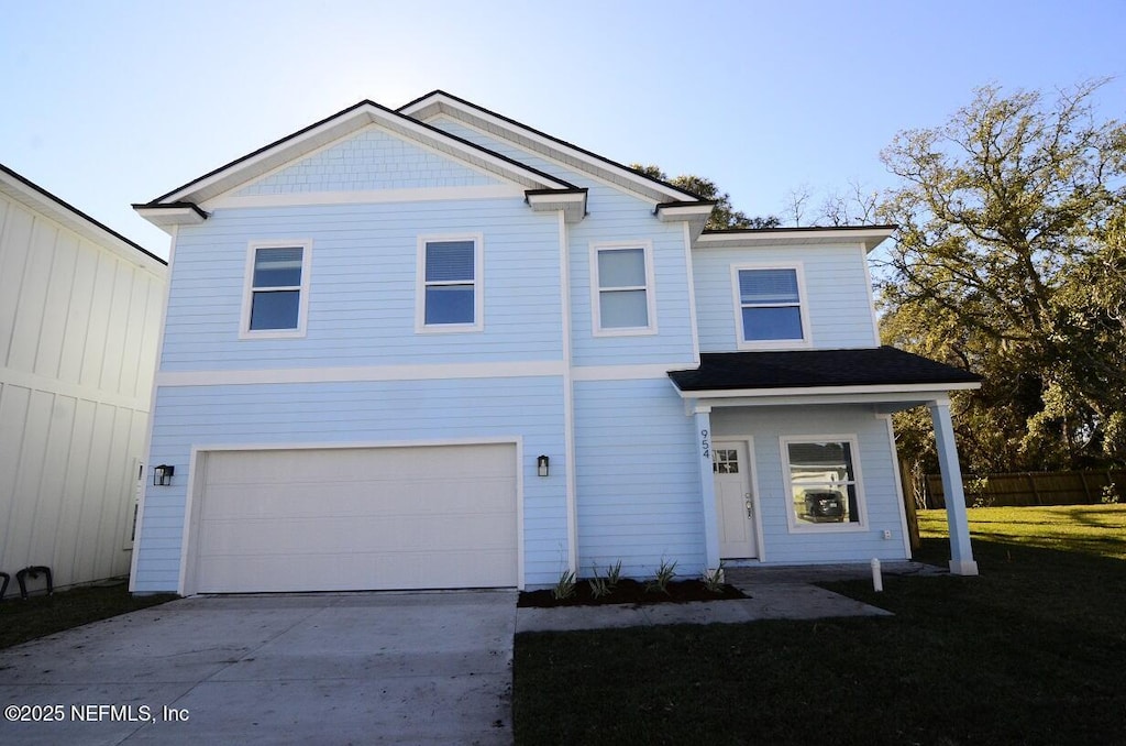 view of front of home featuring driveway and an attached garage