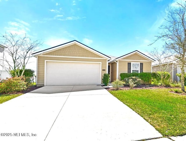 single story home featuring a front lawn, an attached garage, and driveway