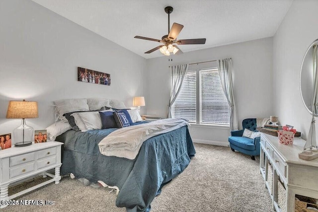 bedroom with ceiling fan, baseboards, and light colored carpet