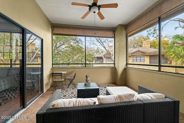 sunroom with ceiling fan and plenty of natural light