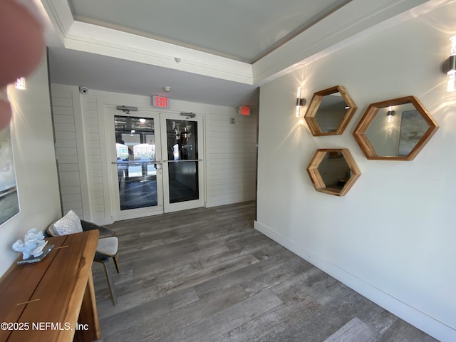 hall featuring wood finished floors and baseboards