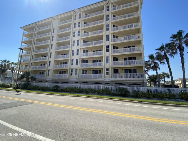 view of building exterior with fence