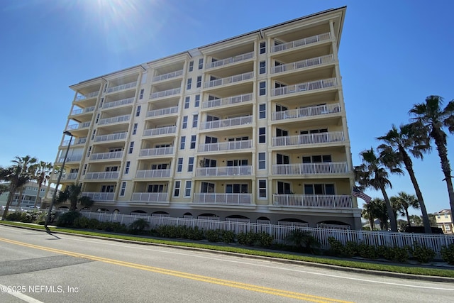 view of building exterior with fence