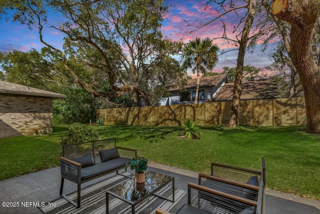 exterior space featuring a yard, a patio area, and fence