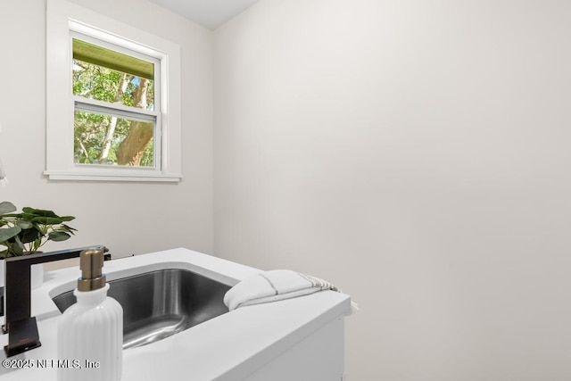 details featuring light countertops and a sink