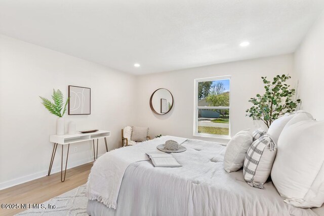 bedroom featuring recessed lighting, light wood-type flooring, and baseboards