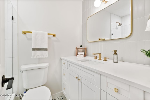 bathroom with walk in shower, vanity, and toilet