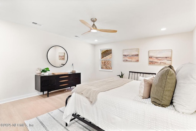 bedroom featuring baseboards, visible vents, a ceiling fan, light wood-type flooring, and recessed lighting