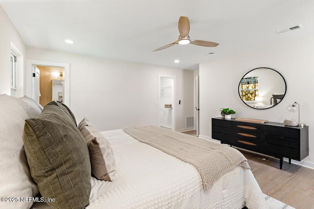 bedroom with recessed lighting, visible vents, light wood-style flooring, and baseboards