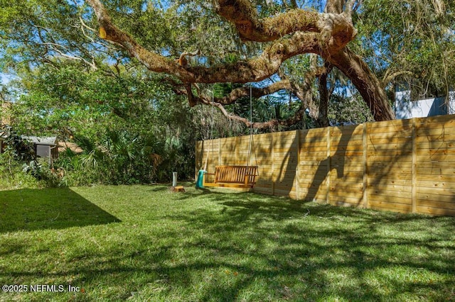 view of yard with fence